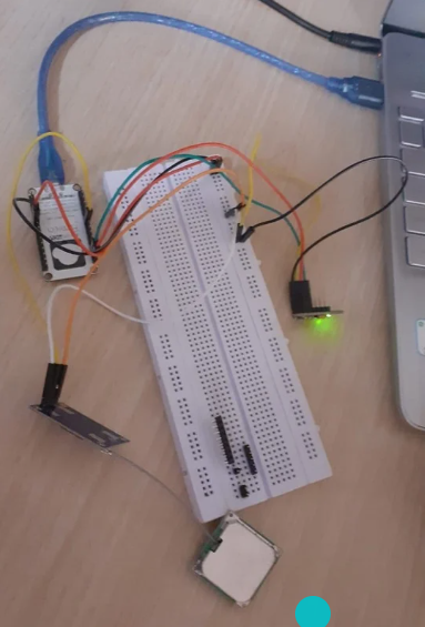Breadboard prototype of the smart helmet electronics connected to a laptop